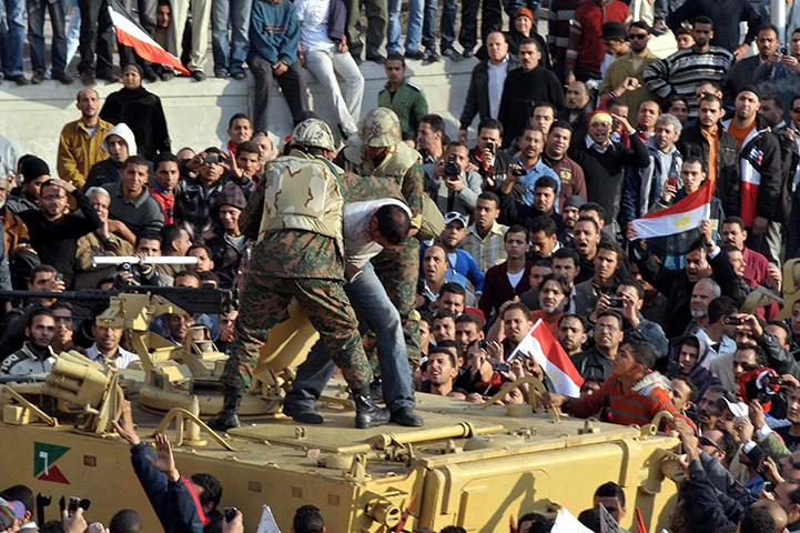 Battle for Egypt: Demonstrators for and against the government clash in Cairo