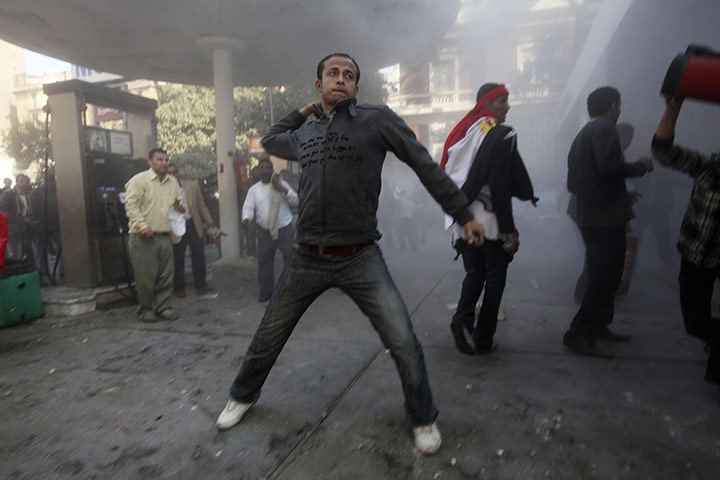 Battle for Egypt: Demonstrators for and against the government clash in Cairo