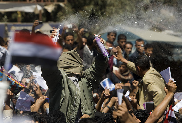 Arab protests: Sana'a, Yemen: Anti-government protesters spray foam