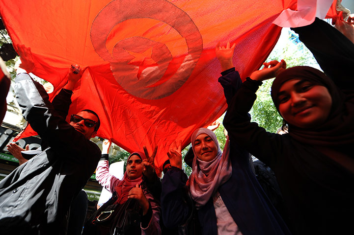 Arab protests: Tunis, Tunisia: Protesters shout slogans during a demonstration