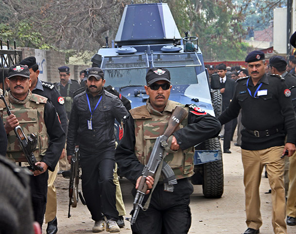 Pakistan: Pakistani police escort an armoured vehi