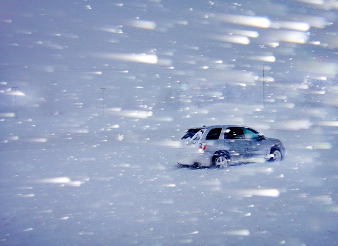 24 hours: Minnesota, USA: Heavy snow is blown by high winds along Highway 13 