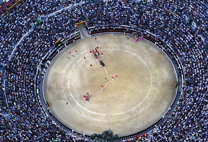 24 hours: Bogota, Colombia: An aerial view of a bull being taken out of a bullring