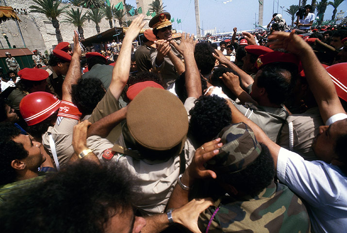 Muammar Gaddafi : Gaddafi appears at a parade in 1987 to commemorate the 18th anniversary of the Libyan revolution