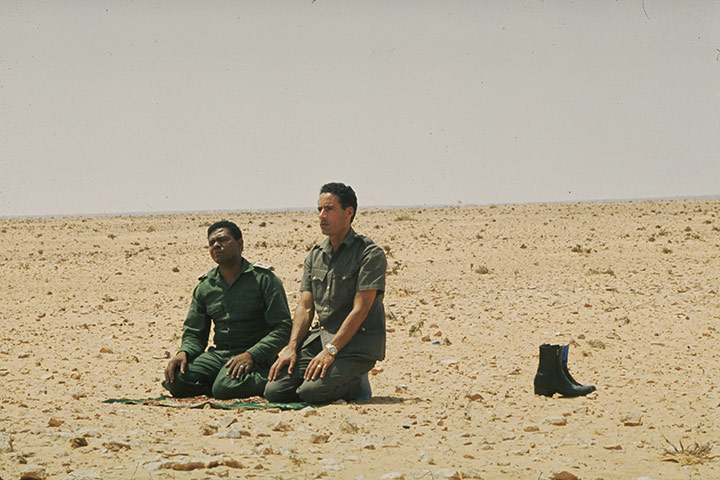 Muammar Gaddafi : August 1973: praying in the desert near Surt