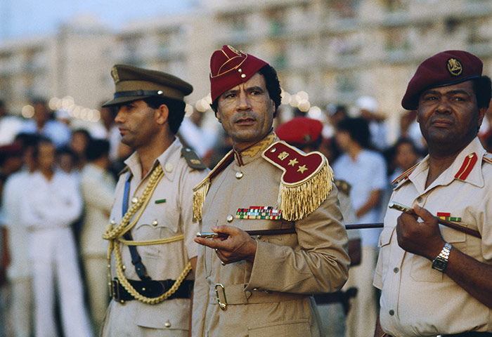 Muammar Gaddafi : Gaddafi at women's military academy graduation in 1981