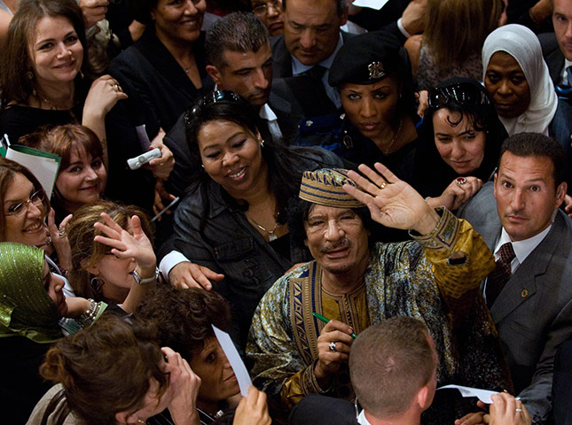 Muammar Gaddafi : June 2009: Libyan leader Muammar Gaddafi waves to photographers 