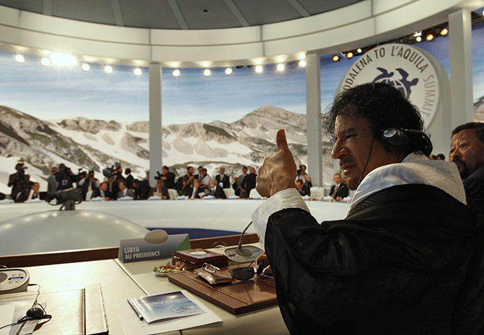 Muammar Gaddafi: July 2009: Giving a thumbs up at the G8 summit in L'Aquila, Italy 