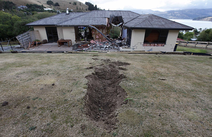 Christchurch earthquake: A hole, created by a giant boulder which crashed through a house 