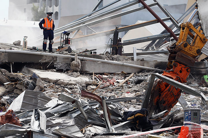 Christchurch earthquake: Rescue workers work on the remains of the CTV building 