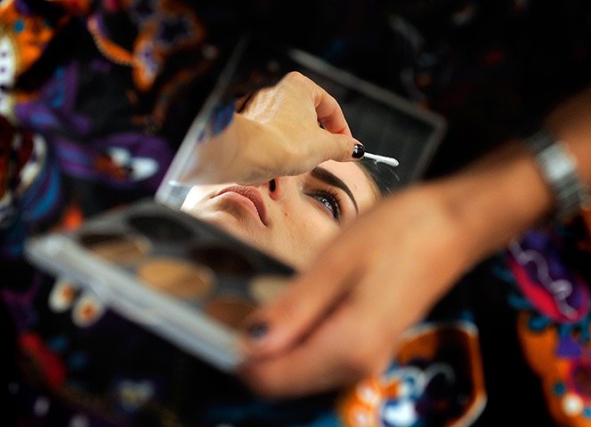 24 hours in pictures: A model is pictured backstage during Madrid Fashion Week