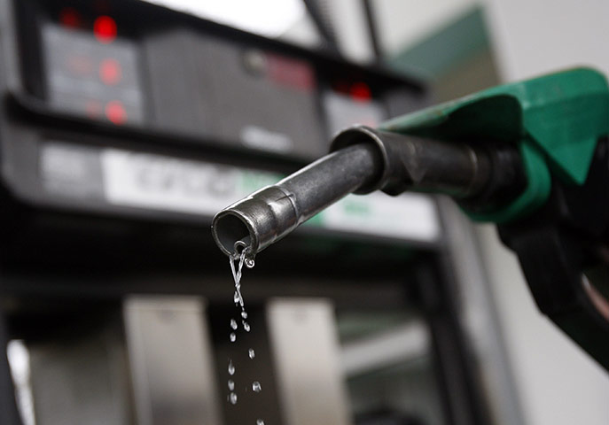 Week in Business: Petrol drips from a  pump at a petrol station in London