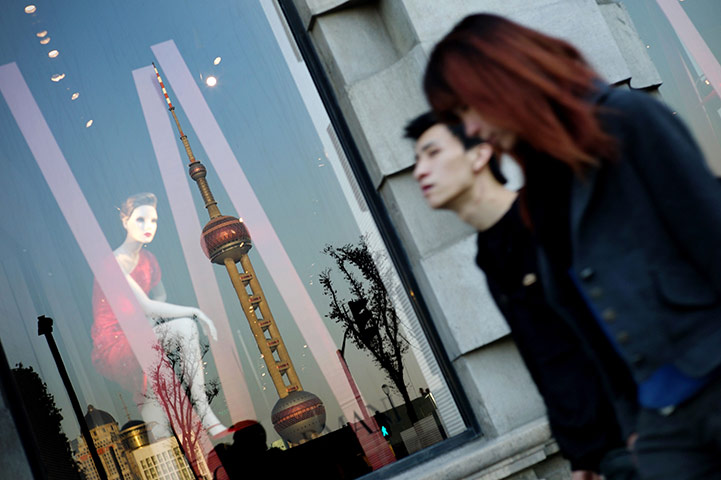 Week in Business: A luxury shop window showing the reflection of Shanghai's Pearl Towe