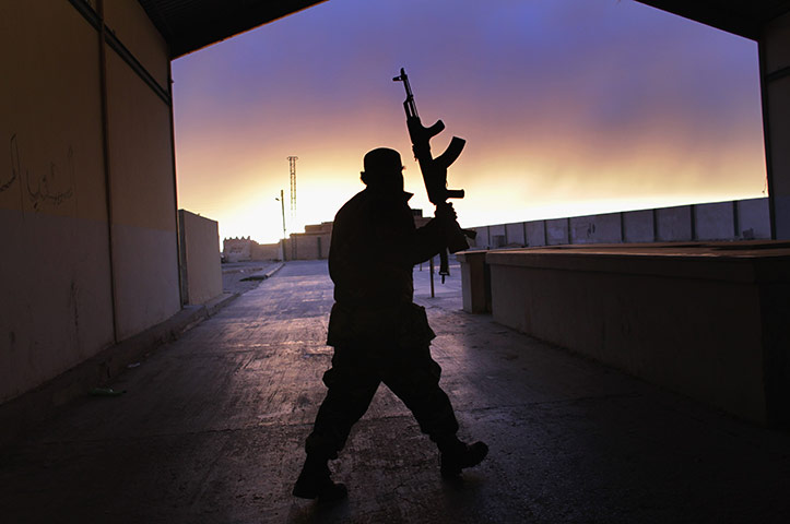 Libya 25: A Libyan border guard walks through an empty customs hall 
