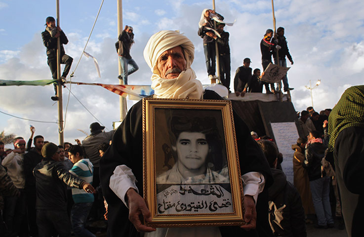 Libya 25: A portrait of his son Fathig during a protest