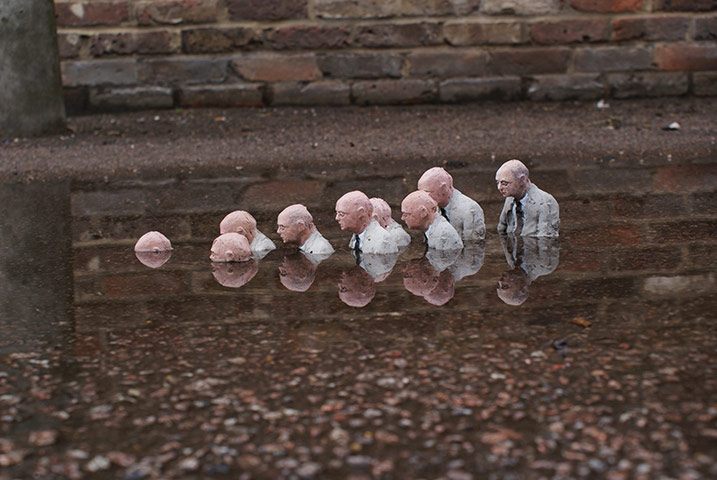 miniature sculpture: Follow the Leader from Isaac Cordal’s Cement Eclipses series