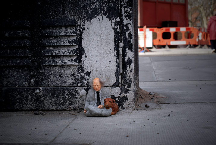 miniature sculpture: Business Man by Isaac Cordal