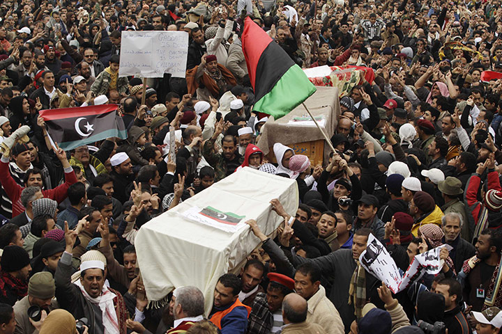Libya 25 update: Mourners carry coffins containing the bodies of Libyans who were killed