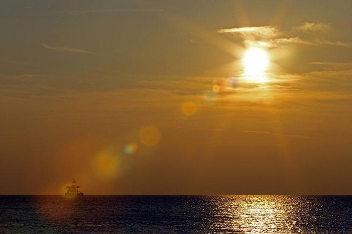 24 hours in pictures: an offshore floating oil platform off the coast of italy