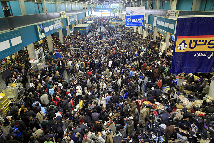 Libya: The scene at the departure hall at Tripoli airport as civilians try to leave Libya
