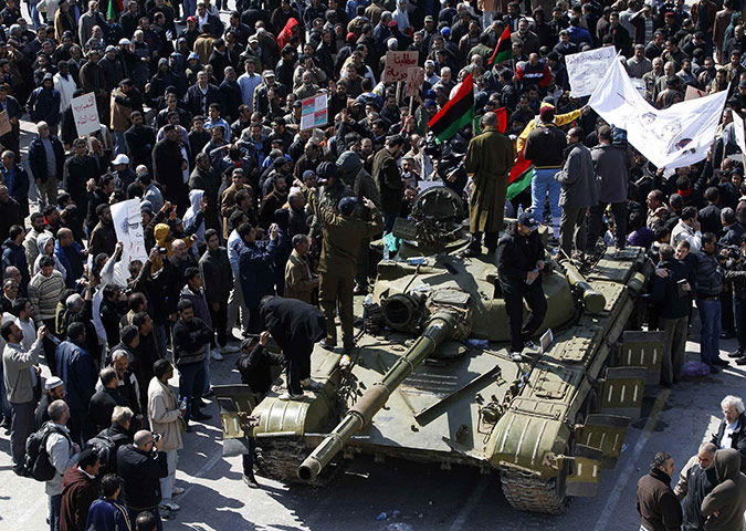 Libya: An army tank is surrounded by protesters in the city of Zawiya