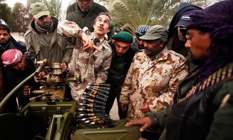 Libyan rebel army officer teaches the use of weapons to civilians