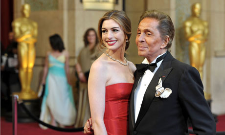 Actress Anne Hathaway and fashion designer Valentino arrive at the Oscars