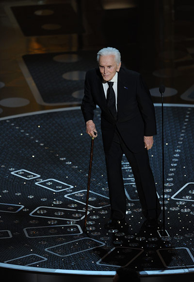 Oscars 2011: winners: Actor Kirk Douglas arrives on stage at t