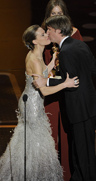 Oscars 2011: winners: Hilary Swank congratulates Tom Hooper