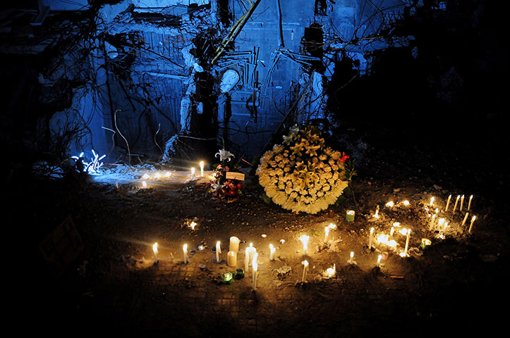 24 hours in pictures: Candles during the one-year commemoration of Chile earthquake