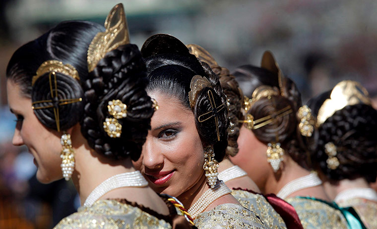 24 hours in pictures: A group of 'Falleras' wearing traditional costumes