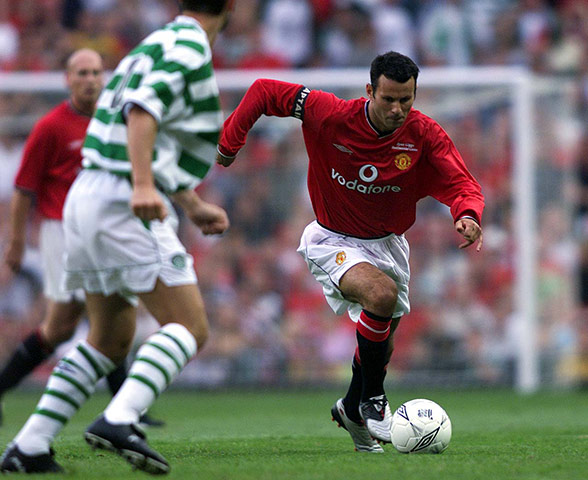 Giggs 20 Years: Giggs of Man Utd goes past Jackie McNamara of Celtic during a testimonial 