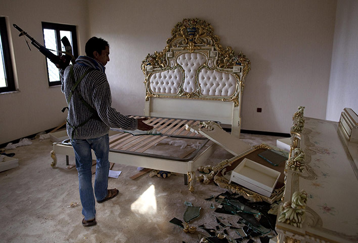 Benghazi celebrates: A Libyan rebel walks
