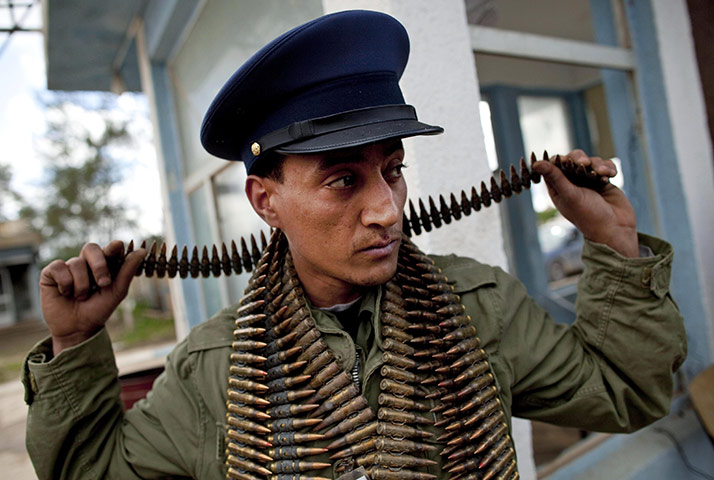 Benghazi celebrates: A Libyan rebel fighting against Gaddafi 