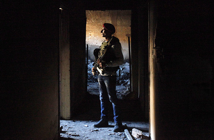 Benghazi celebrates: An anti-government rebel stands in a prison 