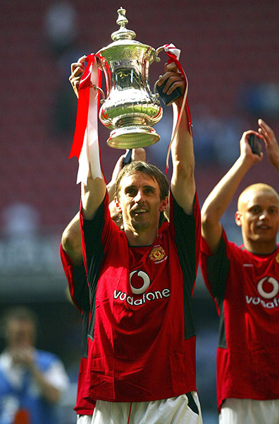 Gary Neville retires: Gary Neville lifts the FA Cup