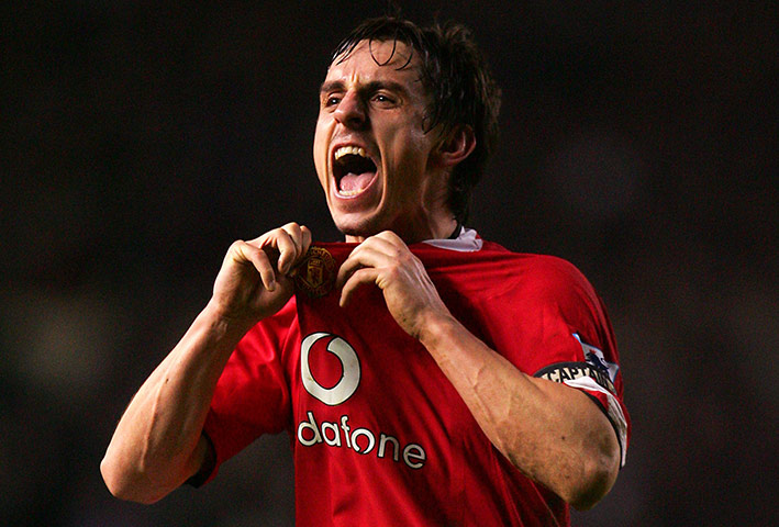 Gary Neville retires: Manchester United's Gary Neville celebrates in front of the Liverpool fans 