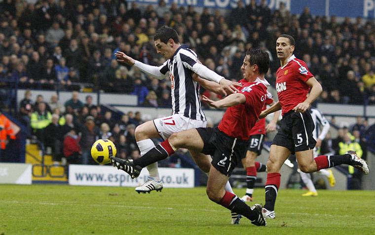 Gary Neville retires: Gary Neville fouls Graham Dorrans