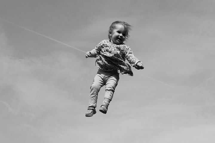 In pictures: play: Girl being thrown in the air