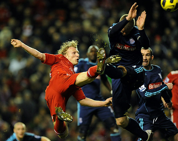 Wednesday Premier League: Dirk Kuyt of Liverpool and Robert Huth of Stoke compete for a high ball