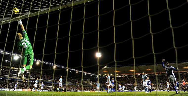 Wednesday Premier League: Manchester City's goalkeeperJoe Hart tips the ball over the crossbar