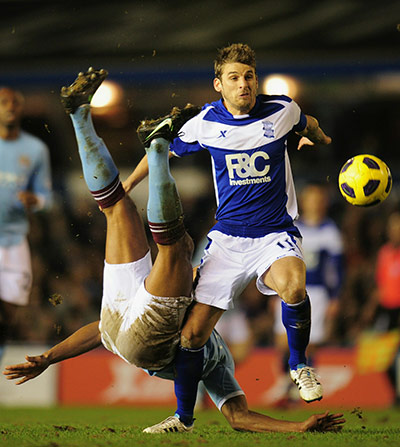Wednesday Premier League: David Bentley of Birmingham City and Vincent Kompany of Manchester City