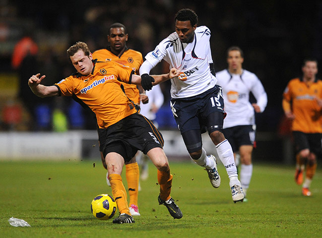 Wednesday Premier League: Wolves Richard Stearman and Bolton's Daniel Sturridge battle for the ball