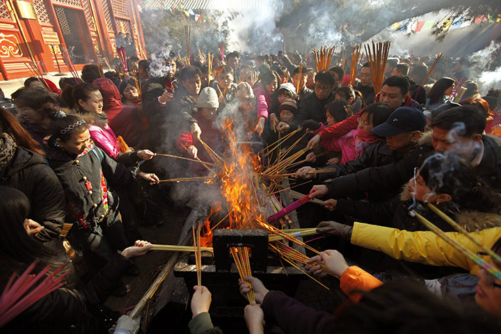 Chinese New Year: Locals burn incense to pray for good fortune in Beijing