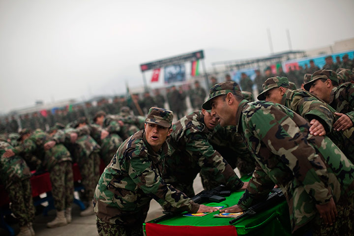24 hours in pictures: Afghan National Army recruits swear in at an oath ceremony