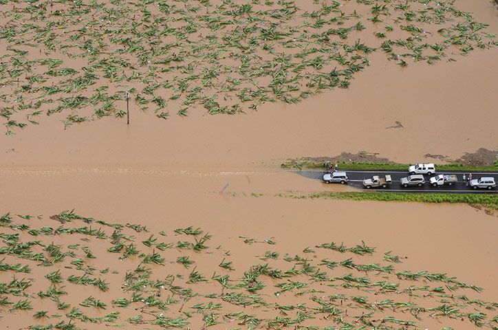24 hours in pictures: Cars are blocked by flood waters on the  Bruce Highway, Australia