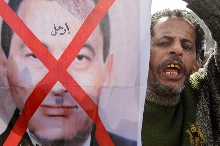 Egyptian Protests: An Egyptian protester shouts anti-Mubarak slogans during a protest