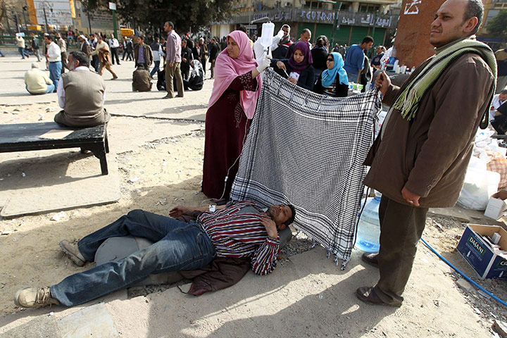 Egyptian Protests: An Egyptian anti-government protester hooked to an IV drip