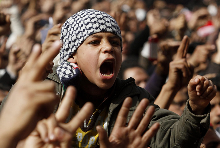 Egyptian Protests: A boy shouts anti-Mubarak slogans after Friday prayers at Tahrir Square