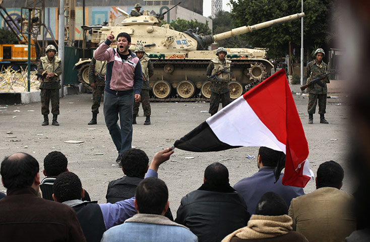 Egypt 05/02: A protester leads fellow demonstrators in chants against Mubarak